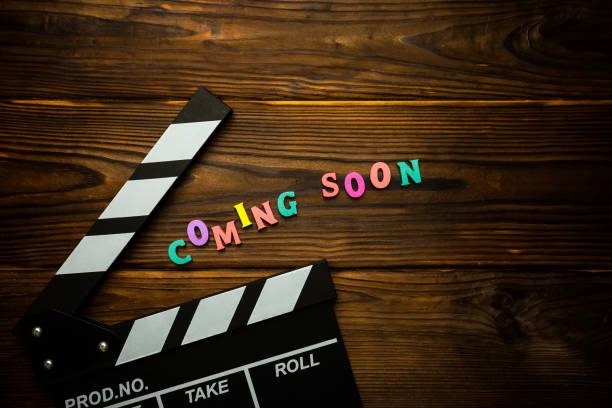 istock Coming soon text on the wooden background 1254575925