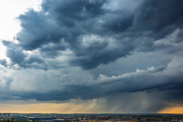 istock Stormy thunderclouds with heavy rain over the city. 1254576050