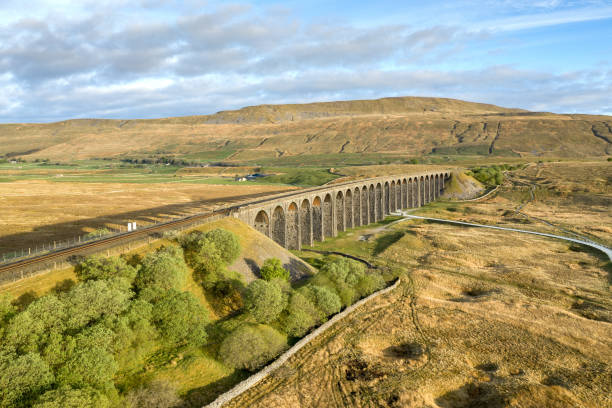 Aerial of The Ribblehead Viaduct a Grade II listed structure. Aerial of The Ribblehead Viaduct a Grade II listed structure. in Horton in Ribblesdale, England, United Kingdom ingleborough stock pictures, royalty-free photos & images