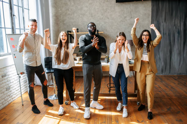 istock A multiracial team rejoices in office 1254577081
