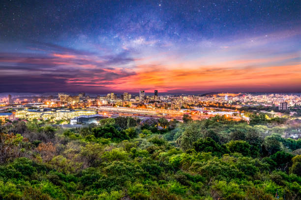 Pretoria city at night with sky full of stars and illuminated buildings and streets Pretoria city at night with sky full of stars and illuminated buildings and streets in Gauteng South Africa pretoria stock pictures, royalty-free photos & images