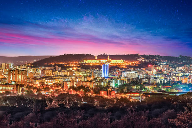 Pretoria city at night with twilight and stars in the sky Pretoria city at night with twilight and stars in the sky in Gauteng South Africa pretoria stock pictures, royalty-free photos & images