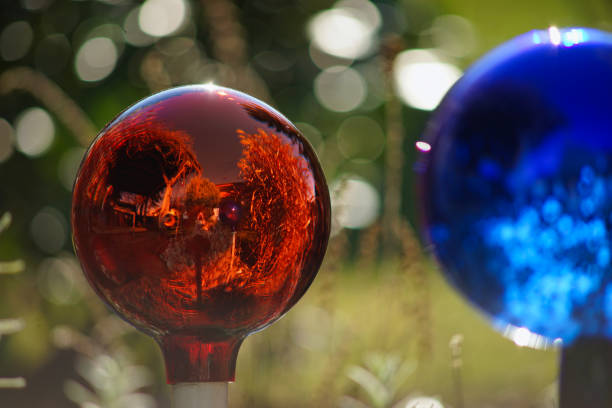 Gazing ball in the garden with soft bokeh