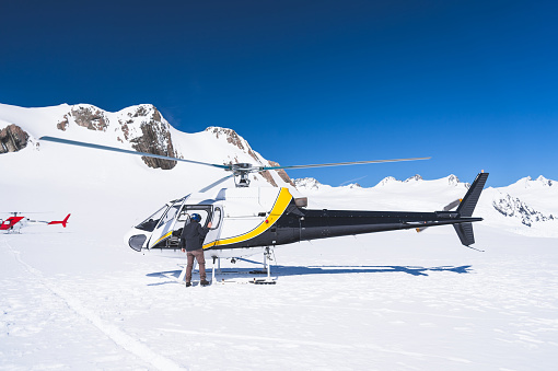 Fox glacier ,New zealand - October 24 2015 ; Helicopter service for landing on snow mountain in Fox Glacier town Southern Alps Mountain Valleys  south island Newzealand