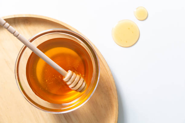 istock Fresh honey bee in bowl on white background. top view 1254581114