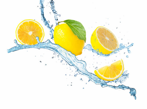 istock Fresh lemon and water splash on white background. 1254581155