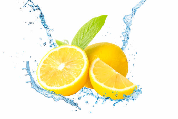 istock Fresh lemon and water splash on white background. 1254581178