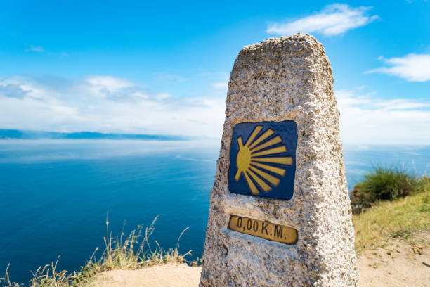 Milestone at Finisterre lighthouse, the end of the St. James Way (Camino de Santiago) Milestone at Finisterre lighthouse, the end of the St. James Way (Camino de Santiago) galicia stock pictures, royalty-free photos & images
