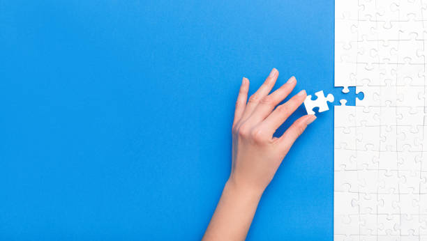 istock Business concept of white jigsaw puzzle. 1254585517