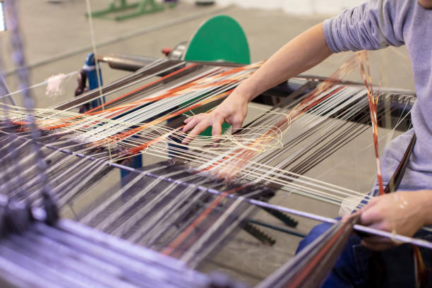 istock Man Working on Weaving Machine for Weave Handmade Fabric 1254586557