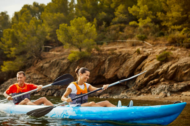 istock Smiling Couple Kayaking On River During Summer Post Covid-19 1254587480