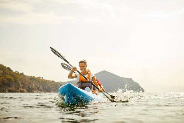 istock Happy Woman Kayaking On River During Summer Post Covid 1254587559