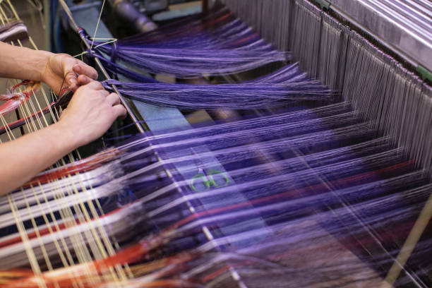 istock Man Working on Weaving Machine for Weave Handmade Fabric 1254589150