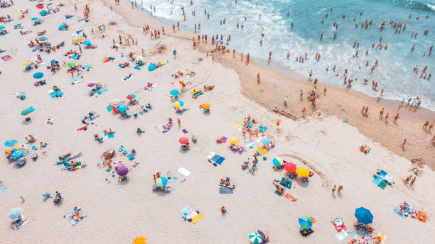 Aerial view of the beach Aerial view of the beach beach umbrella aerial stock pictures, royalty-free photos & images