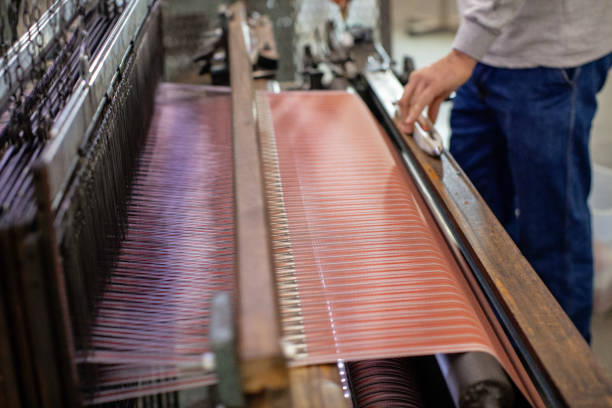 istock Man Working on Weaving Machine for Weave Handmade Fabric 1254589710