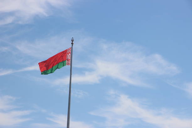 istock Flag of Belarus at the blue sky background 1254589777