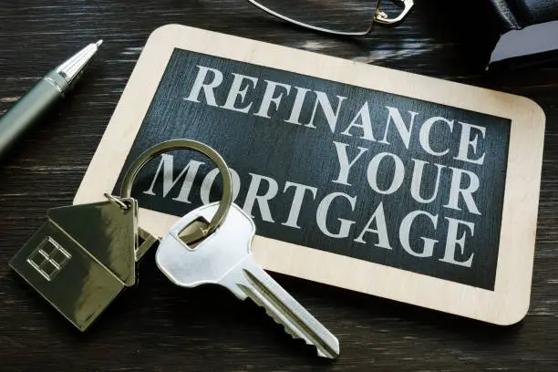 Photo of Refinance your mortgage word on the small blackboard.