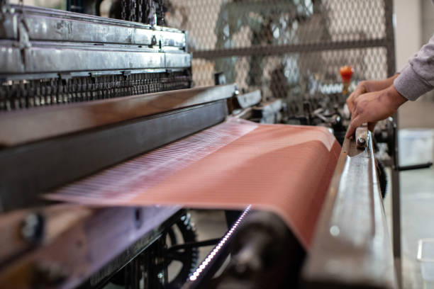 istock Man Working on Weaving Machine for Weave Handmade Fabric 1254591070