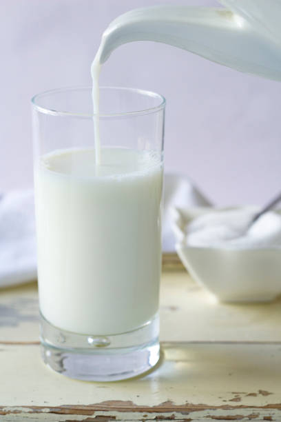istock A milk jug filling a glass. 1254591215