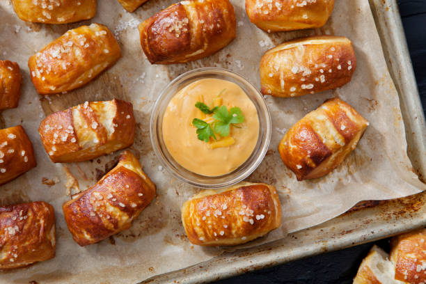 Soft Pretzel Bites with A Spicy, Cheesy Salsa Con Queso Dip Soft Pretzel Bites with A Spicy, Cheesy Salsa Con Queso Dip pretzel photos stock pictures, royalty-free photos & images