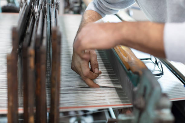 istock Man Working on Weaving Machine for Weave Handmade Fabric 1254591280