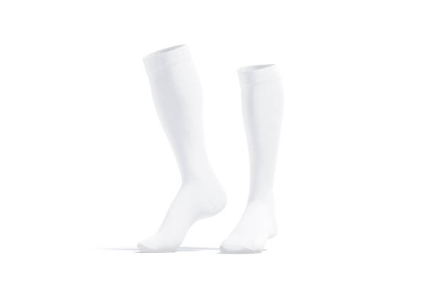 Blank white pair soccer socks toe mockup, half-turned view Blank white pair soccer socks toe mockup, half-turned view, 3d rendering. Empty textile foot-wear for sporty mock up, isolated. Clear long stockings or uppers for football mokcup template. football socks stock pictures, royalty-free photos & images