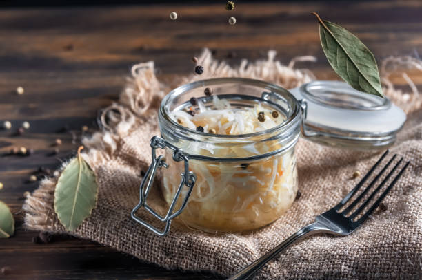 istock fermented vegetables on wooden background. Sauerkraut. carrots 1254591921