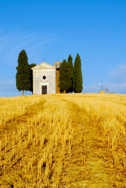 Ancient Chapel in agricultural field. Chianti region, Tuscany, Italy.