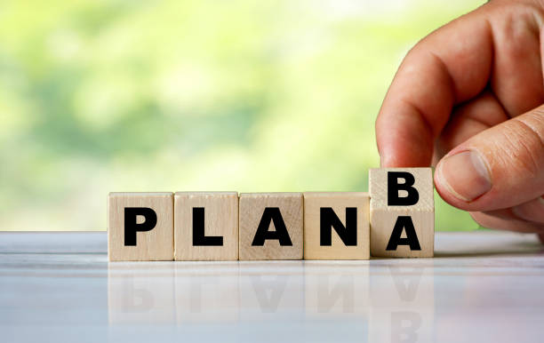 istock The hand turns the wooden cube and changes the word PLAN A to PLAN B 1254594141