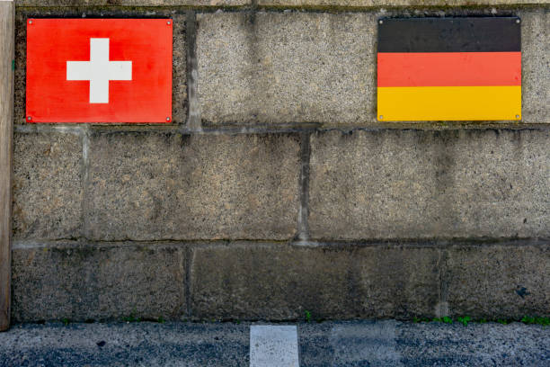 border crossing from Switzerland into Germany with flags and line on the bridge in Laufenburg The border crossing from Switzerland into Germany with flags and line on the bridge in Laufenburg aargau canton photos stock pictures, royalty-free photos & images