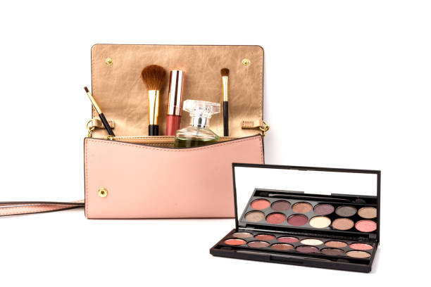 istock Cosmetics, perfume, brushes, patelle with eye shadows. female cosmetics bag on white background. Make up. Copy space. Set of woman's cosmetics in a bag. Women's secrets. 1254596961