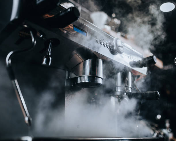 istock Thick steam is wrapped in a professional coffee machine - coffee shop equipment 1254600548