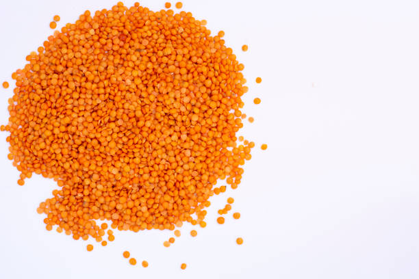 istock red lentils in a basket on a white background. 1254600760