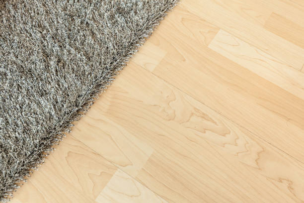 Furly carpet on wooden floor stock photo