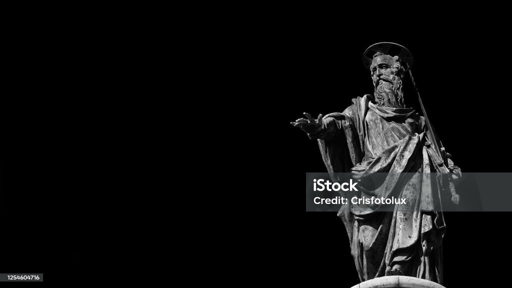 St Paul Apostle of Christianity (Black and White with copy space) Roman Catholic Church. St Paul statue (16th century) at the top of Column of Marcus Aurelius in the center of Rome Paul the Apostle Stock Photo