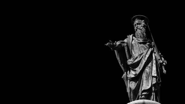 St Paul Apostle of Christianity (Black and White with copy space) Roman Catholic Church. St Paul statue (16th century) at the top of Column of Marcus Aurelius in the center of Rome apostle worshipper photos stock pictures, royalty-free photos & images