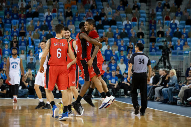 istock Basketball players celebrating 1254608367