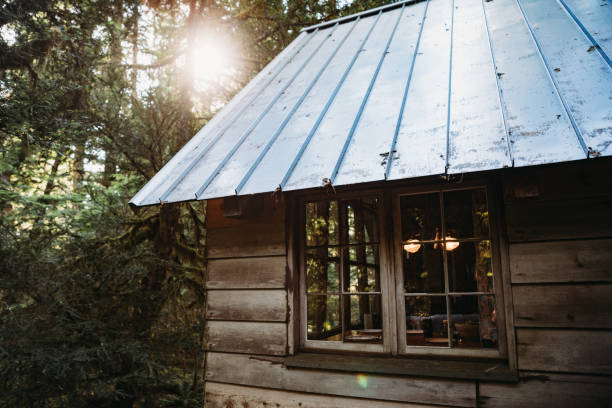 istock Rustic Cabin Retreat In The Forest With Large Bay Windows 1254608613