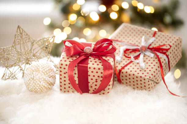 istock New year holiday background with a gift box in a cozy atmosphere. 1254610718