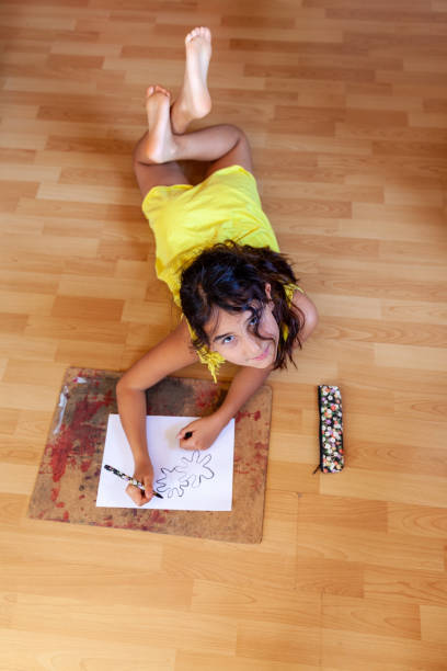 istock Little girl drawing 1254614339