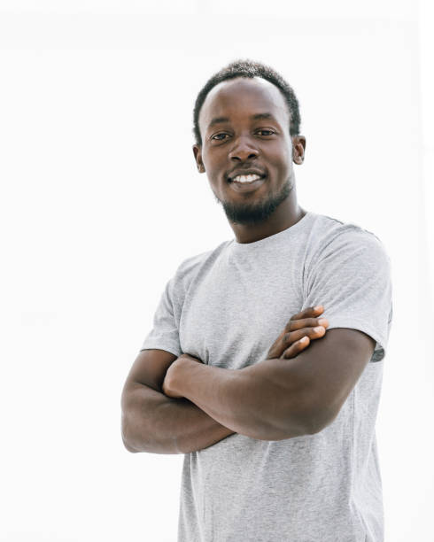 istock confident young man in a white t-shirt. isolated on white 1254614741