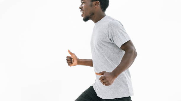 istock side view. smiling handsome guy showing thumbs up 1254614774