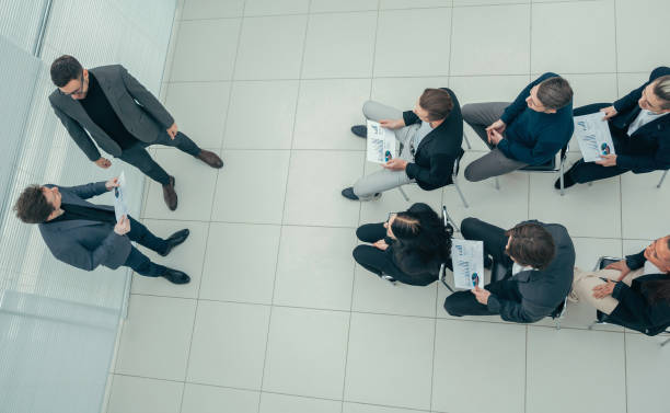 istock top view. working group with financial charts at a joint meeting 1254617904