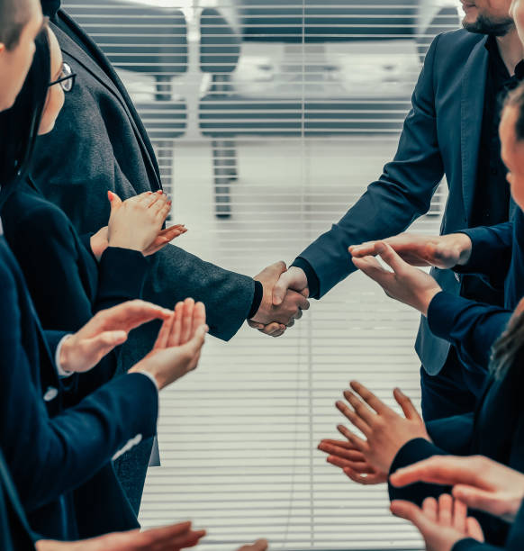 istock financial partners are shaking hands with each other 1254618663