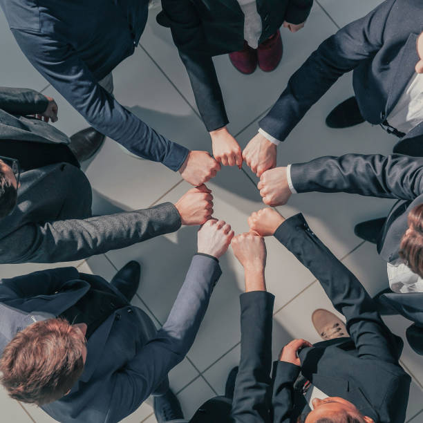 istock close up. a dedicated business team showing their unity 1254618870