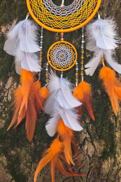 istock Handmade dream catcher with feathers threads and beads rope hanging 1254621234