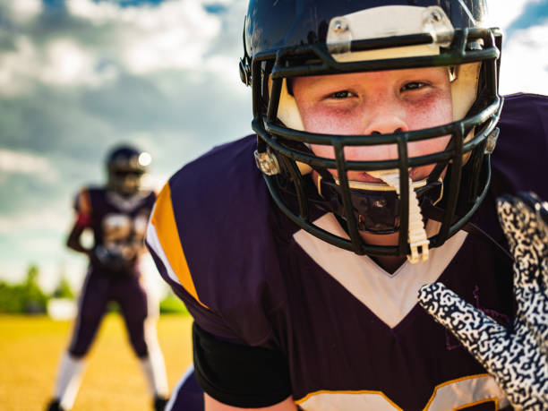 istock Junior Football players during game 1254623562