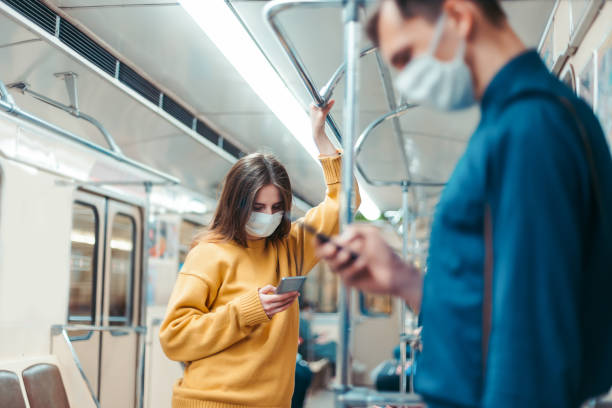 istock people with smartphones standing in a subway car 1254626496