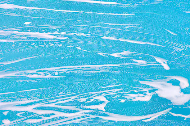 istock Cleaning background texture - chemical soap detergent foam on a clear glass 1254626600
