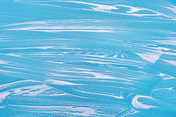 istock Cleaning background texture - chemical soap detergent foam on a clear glass 1254626625